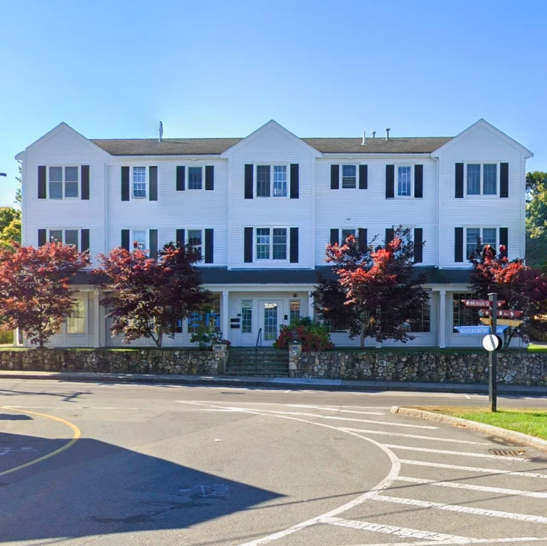 Front of residence shows hyphen gallery on first floor